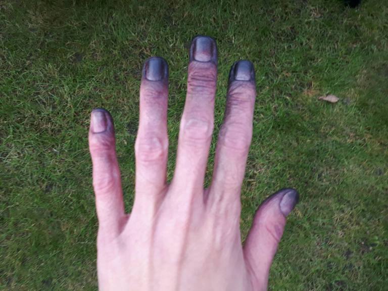 hands graffiti black paint garden